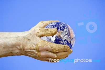 Earth In Hands Of Potter Stock Photo