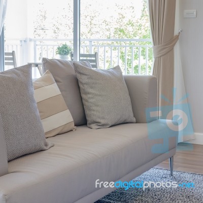 Earth Tone Color Sofa With Pillows In Modern Living Room Stock Photo