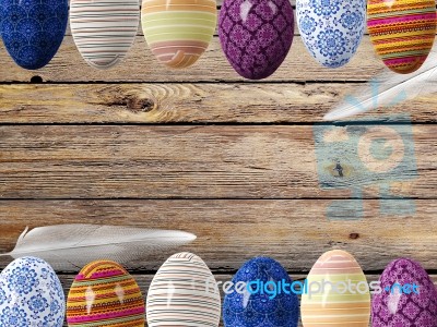 Easter Eggs And Bird Feathers On Wood Background With Space Stock Image