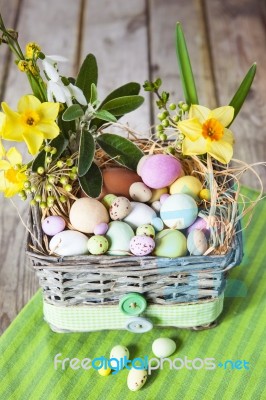 Easter Eggs In The Basket On Green Striped Cloth Stock Photo