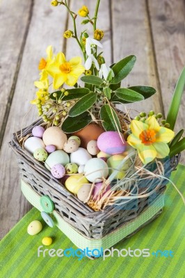 Easter Eggs In The Basket On Green Striped Cloth Stock Photo