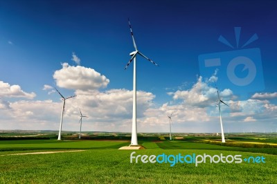 Eco Power. Wind Turbines Generating Electricity Stock Photo