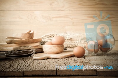 Egg, Chicken Egg In Wood Bowl On Old Wooden Table Stock Photo