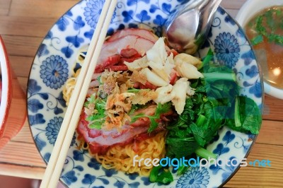 Egg Noodles With Roasted Red Pork With Crab Meat And Pak Choy. Famous Local Thai Stlye Street Food Stock Photo