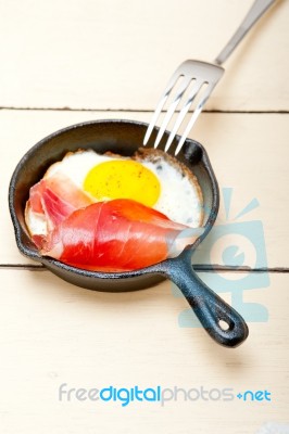 Egg Sunny Side Up With Italian Speck Ham Stock Photo