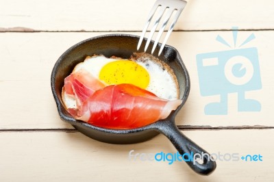 Egg Sunny Side Up With Italian Speck Ham Stock Photo