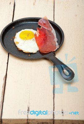 Egg Sunny Side Up With Italian Speck Ham Stock Photo