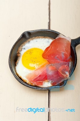 Egg Sunny Side Up With Italian Speck Ham Stock Photo