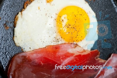 Egg Sunny Side Up With Italian Speck Ham Stock Photo