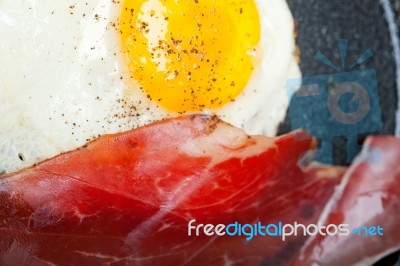 Egg Sunny Side Up With Italian Speck Ham Stock Photo