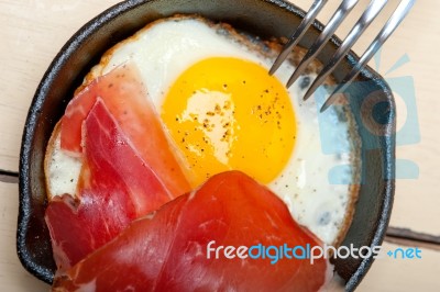 Egg Sunny Side Up With Italian Speck Ham Stock Photo