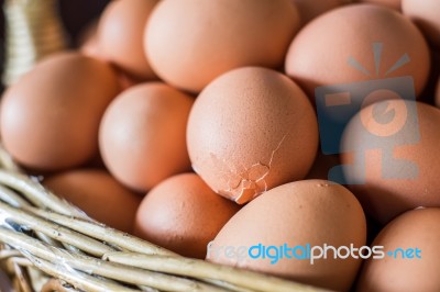 Eggs Break In Wicker Basket Stock Photo