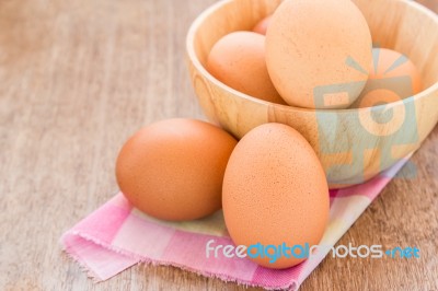 Eggs In A Wooden Bowl On The Table Stock Photo