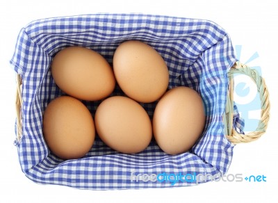 Eggs In Basket Isolated On White Stock Photo