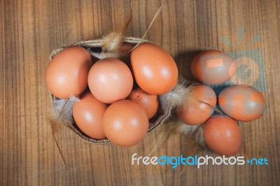 Eggs In Basket On Wood.eggs.egg.brown.rawfood Stock Photo