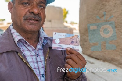 Egyptian Man Showing Entrance Ticket Stock Photo