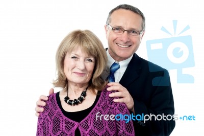 Elderly Couple Smiling To The Camera Stock Photo