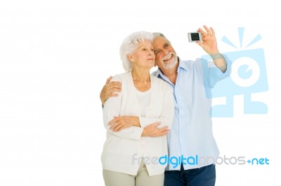 Elderly Couple With Camera Stock Photo