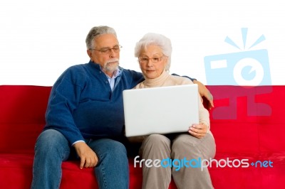 Elderly Couple With Laptop Stock Photo