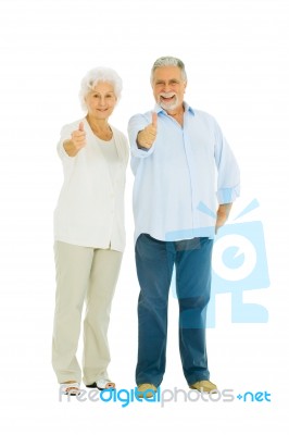 Elderly Couple With Thumbs Up Stock Photo