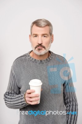 Elderly Man Holding Beverage Stock Photo