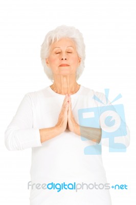 Elderly Woman Practicing Yoga Stock Photo