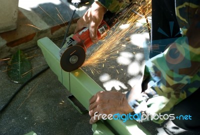 Electric Wheel Grinding On Steel Structure Stock Photo