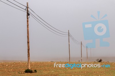 Electricity Wire On A Field Stock Photo