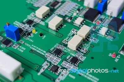 Electronic Circuit Board With Electronic Components Background Stock Photo