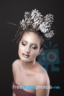 Elegant Girl In The New Year Wreath Of Pine Cones Stock Photo