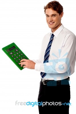 Employee Using Big Green Calculator Stock Photo