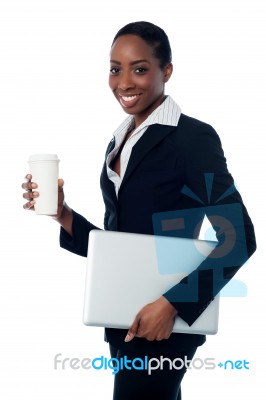 Employer Holding Laptop And Beverage Stock Photo