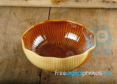 Empty Brown Bowl On The Wooden Background Stock Photo