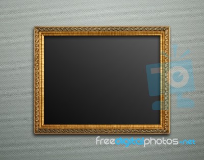 Empty Golden Vintage Frame On Wallpaper Background Stock Photo