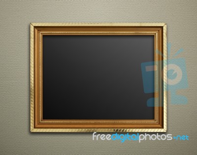 Empty Golden Vintage Frame On Wallpaper Background Stock Photo