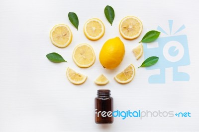 Empty Medicine Bottle With Fresh Lemon Slices And Leaf Stock Photo