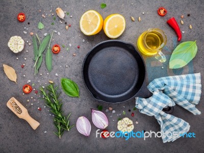 Empty Old Cast Iron Skille On Dark Stone Background. Ingredients… Stock Photo