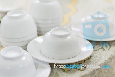 Empty White Plate And Small Chalice On Table Stock Photo