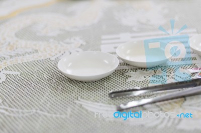 Empty White Plate And Small Chalice On Table Stock Photo