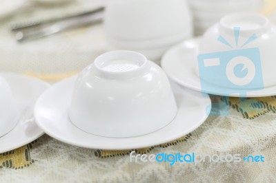 Empty White Plate And Small Chalice On Table Stock Photo