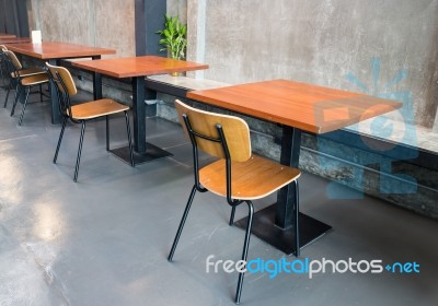 Empty Wooden Table In Grey Room Stock Photo