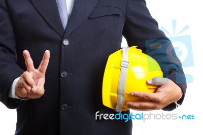 Engineer Holding Helmet On White Background Stock Photo