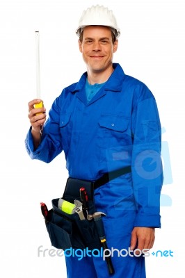 Engineer Holding Measuring Tape Stock Photo