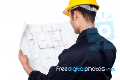 Engineer Reviewing Blueprint Stock Photo