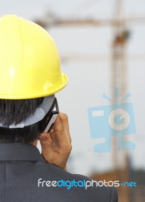 Engineer Talking Over Phone Stock Photo