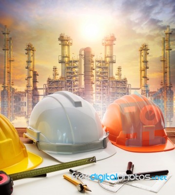 Engineer Working Table Plan, And Oil Refinery Plant In Heavy Petrochemical Industry Stock Photo