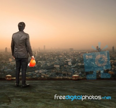 Engineering Man Standing On Top Of Building Looking To Urban Sce… Stock Photo