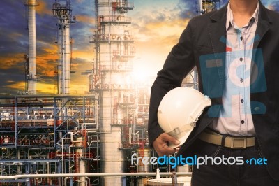 Engineering Man With White Safety Helmet Standing In Front Of Oi… Stock Photo