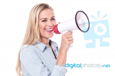 Enthusiastic Woman With A Megaphone Stock Photo