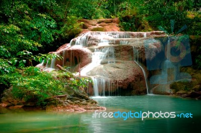 Erawan Waterfall In Thailand In Deep Forest Stock Photo